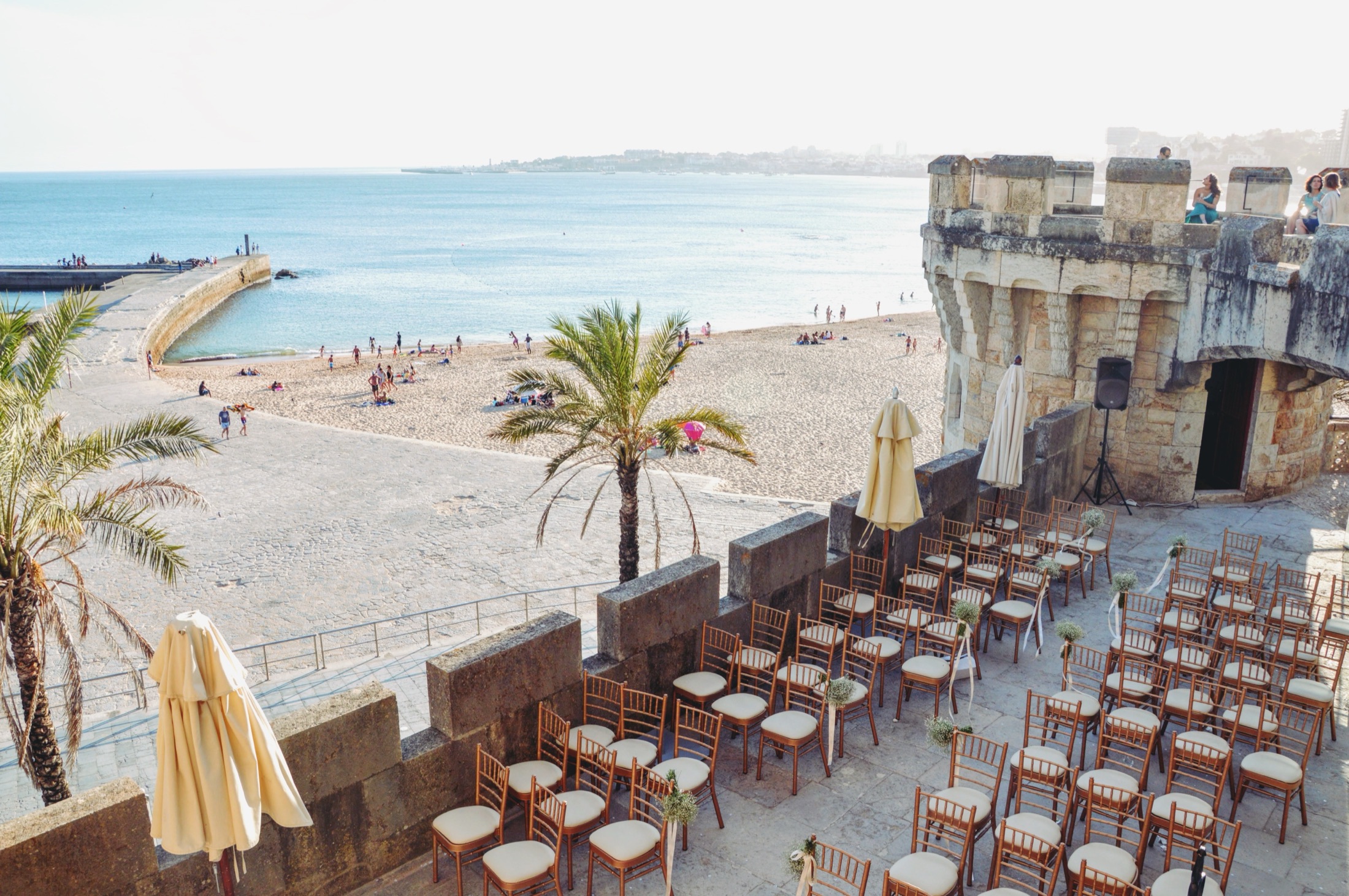 Ceremony chairs on the ramparts of Forte da Cruz above Tamariz Beach, Estoril